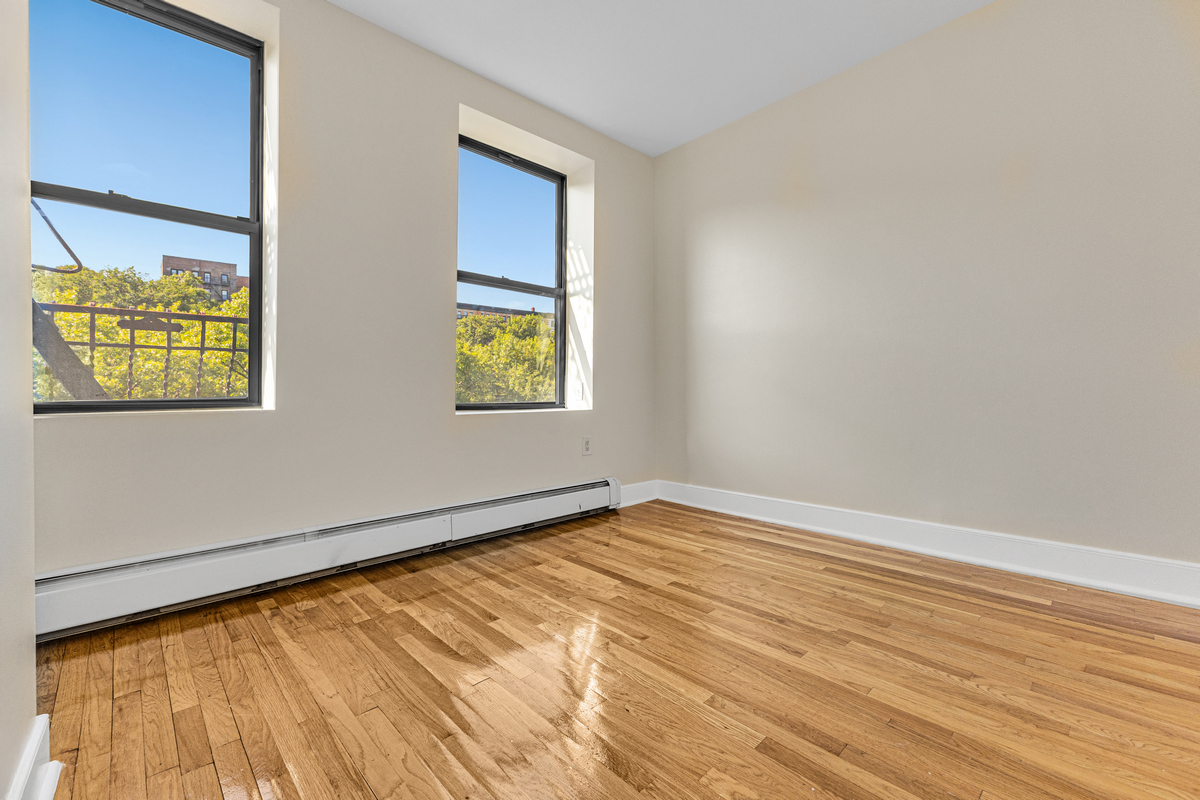 305 West 150th Street, Unit 606 Manhattan, NY 10039 - Photo 3 of 6 a view of an empty room with a window
