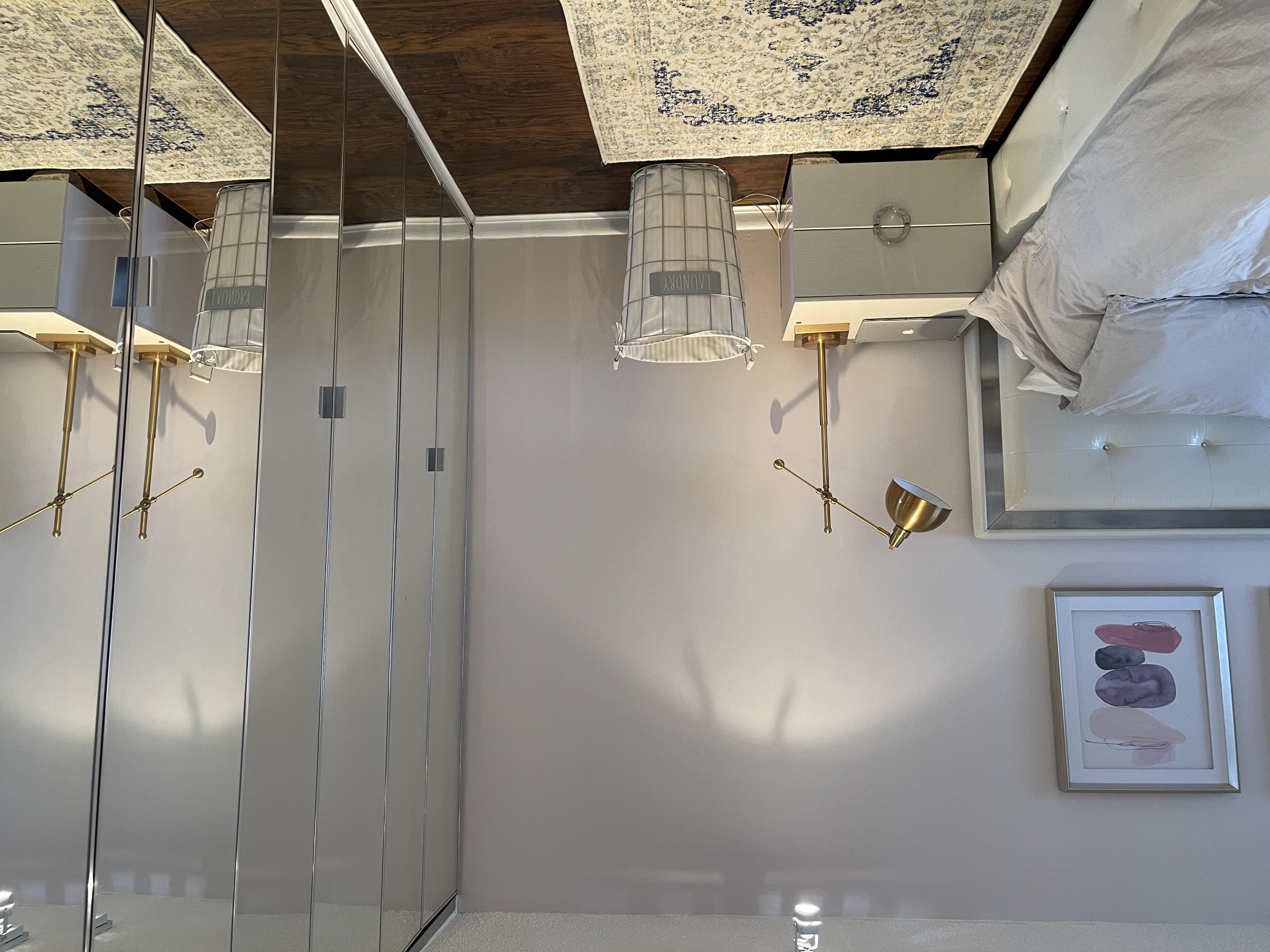 25-40 Shore Boulevard, Unit 8T Queens, NY 11102 - Photo 14 of 23 a room with a couch and wooden floor