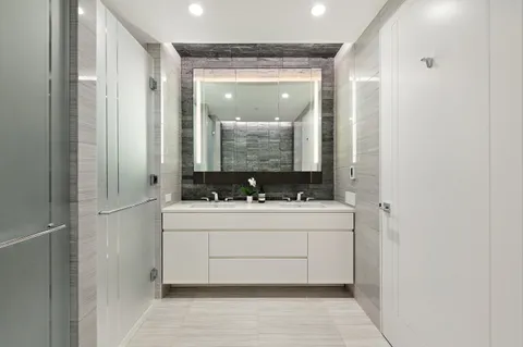 a bathroom with a sink and mirror