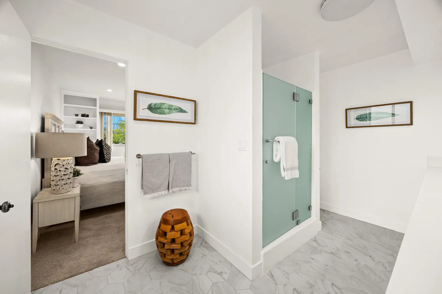 a view of a backyard with table and chairs potted plants and large tree