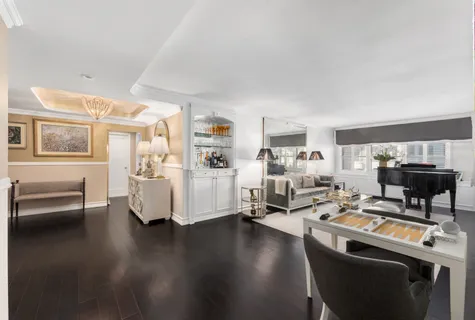 a work room with furniture and wooden floor