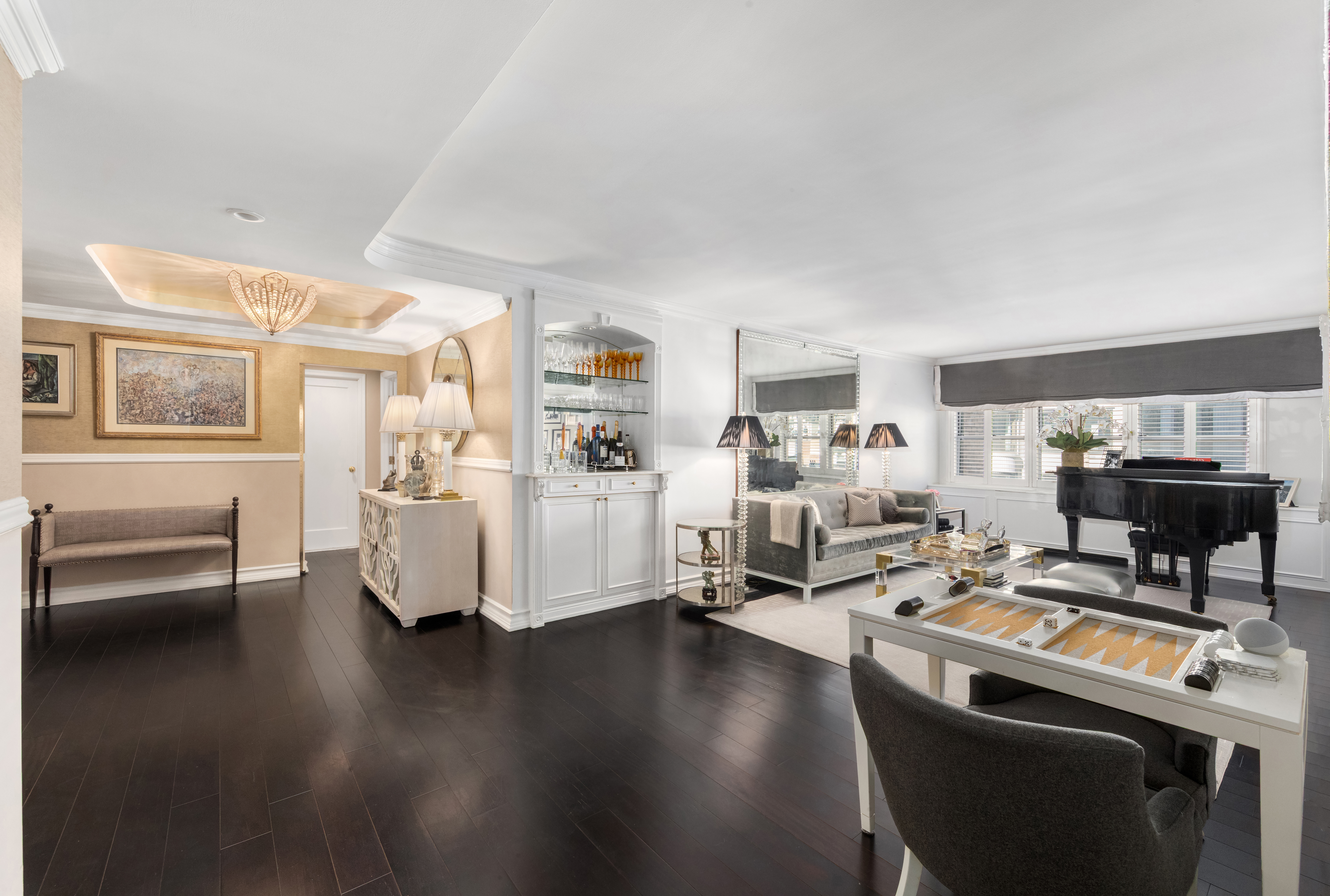 27 East 65th Street, Unit 10BC Manhattan, NY 10065 - Photo 5 of 16 a work room with furniture and wooden floor