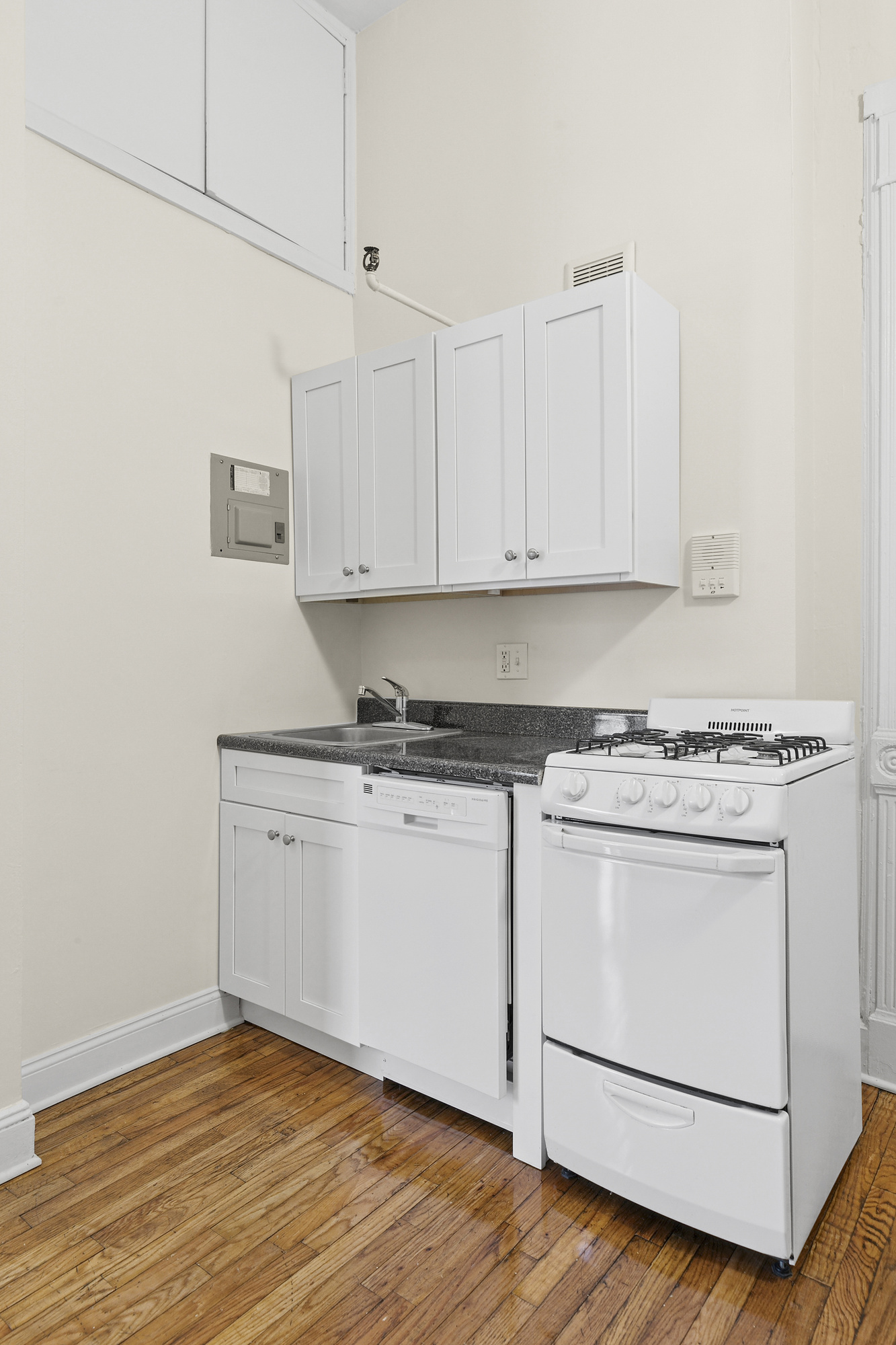1100 Dean Street, Unit 4 Brooklyn, NY 11216 - Photo 4 of 13 a view of kitchen with granite countertop cabinets and wooden floor