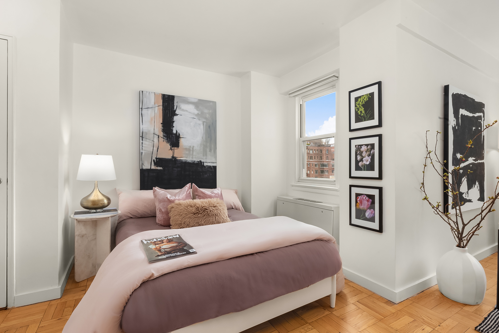 101 West 12th Street, Unit 10F Manhattan, NY 10011 - Photo 5 of 12 a bedroom with a bed and wooden floor