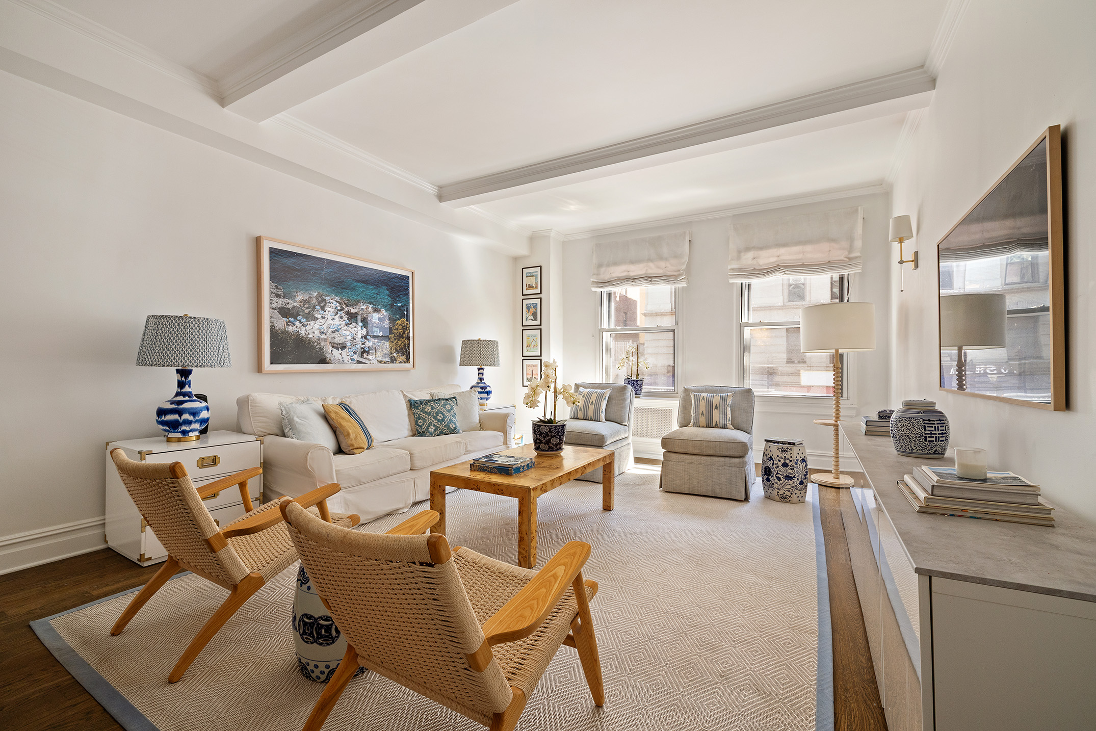 129 East 82nd Street, Unit 1C Manhattan, NY 10028 - Photo 1 of 13 a living room with furniture and a large window