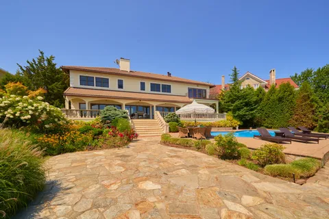 a view of a house with a small yard