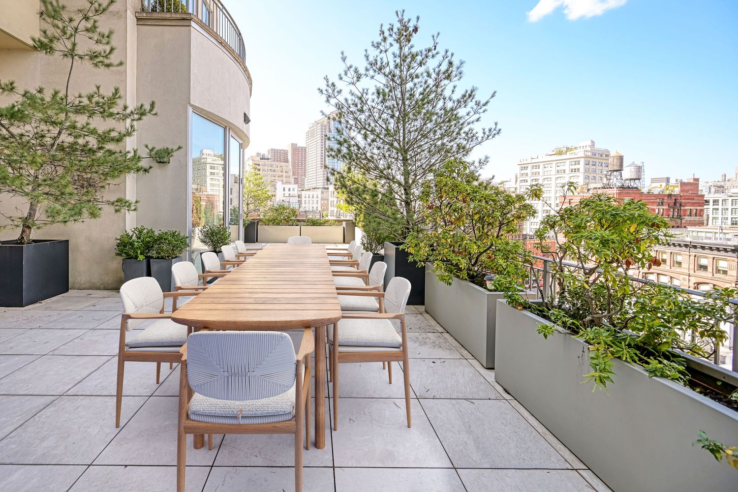 a outdoor dining space with furniture and city view