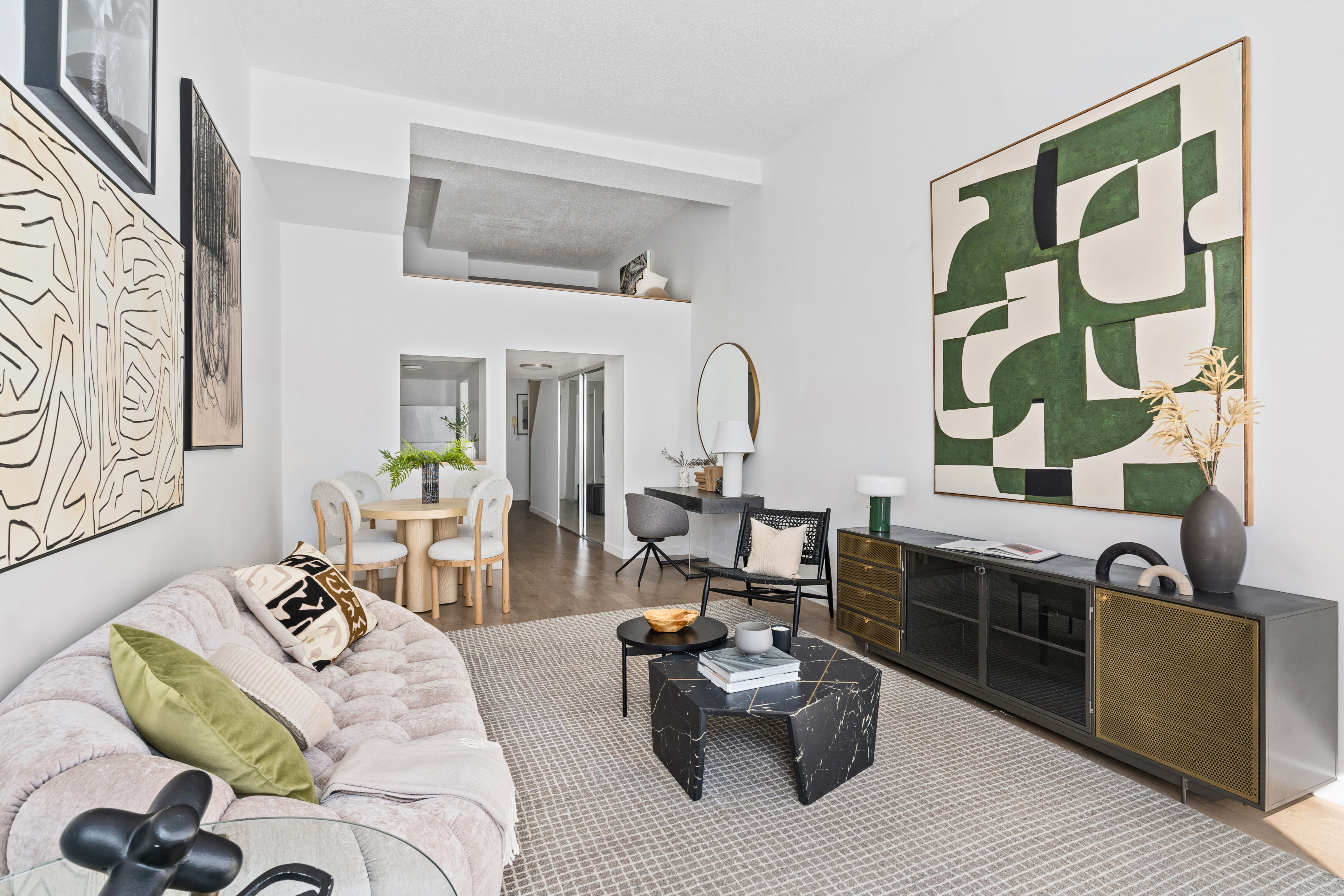 372 5th Avenue, Unit 9J Manhattan, NY 10018 - Photo 2 of 13 a living room with furniture and wooden floor