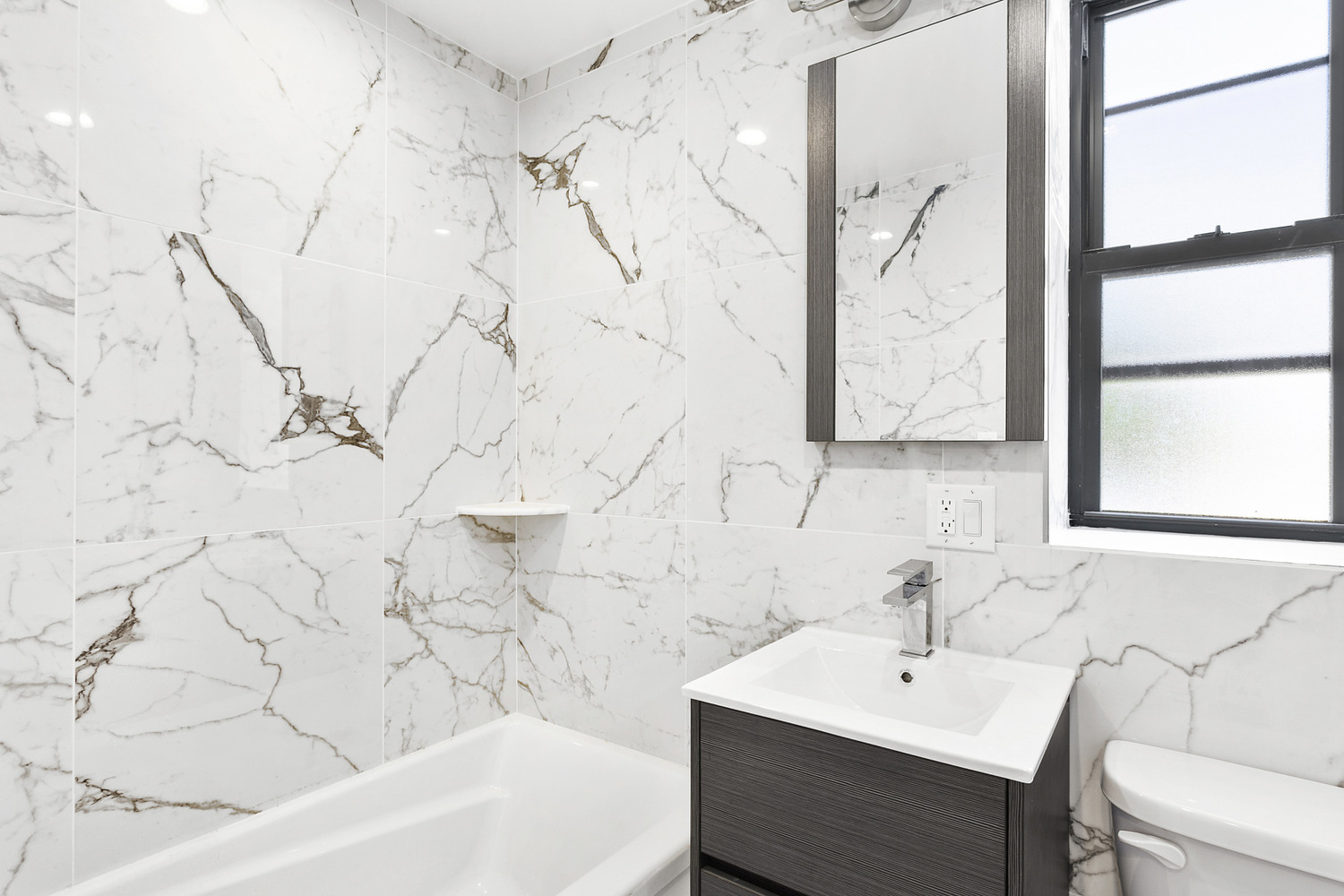 276 3rd Avenue, Unit 4A Brooklyn, NY 11215 - Photo 5 of 6 a bathroom with a sink and a bathtub