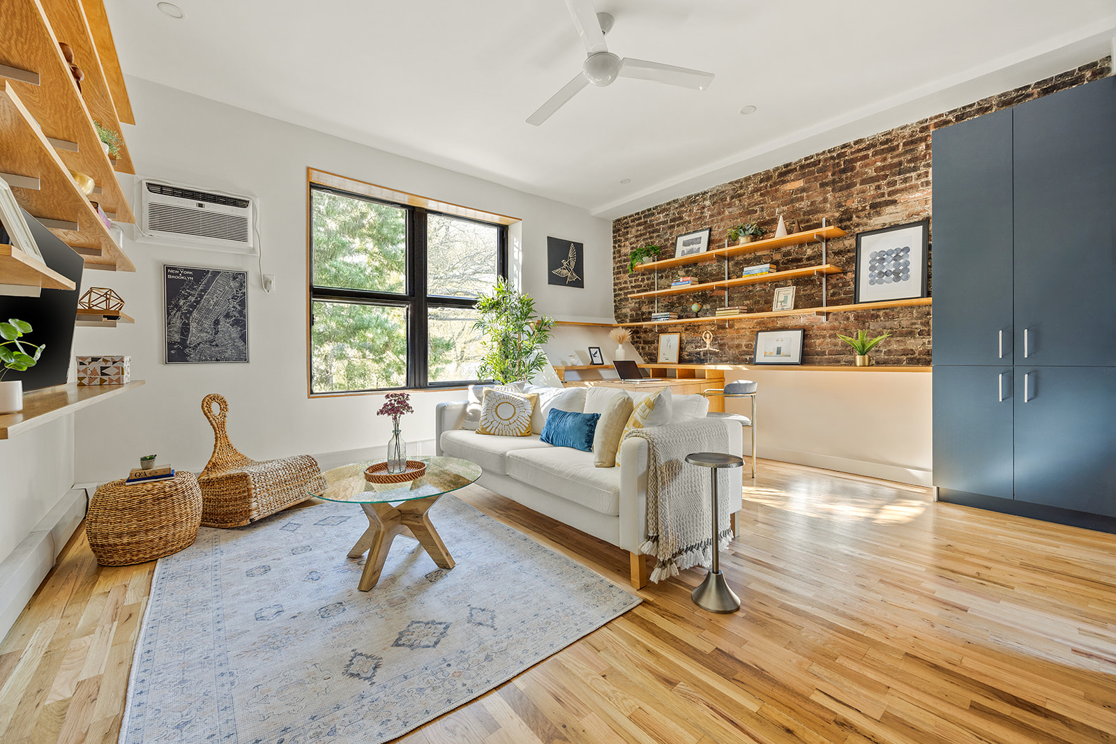 a living room with furniture and next to a window