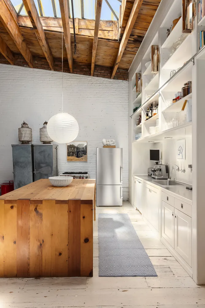 a kitchen with a stove and a refrigerator