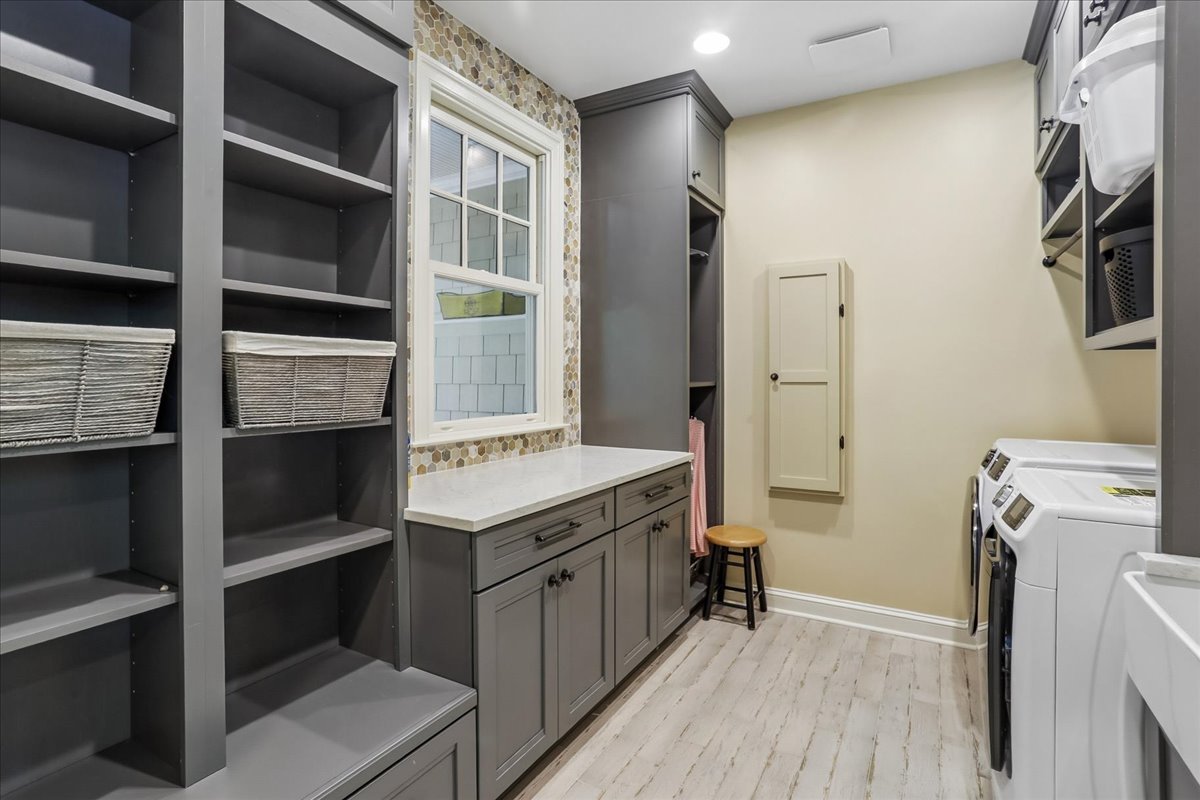 11736 Gainsborough Road Potomac, MD 20854 - Photo 51 of 90 a room with a cabinets and a wooden floor