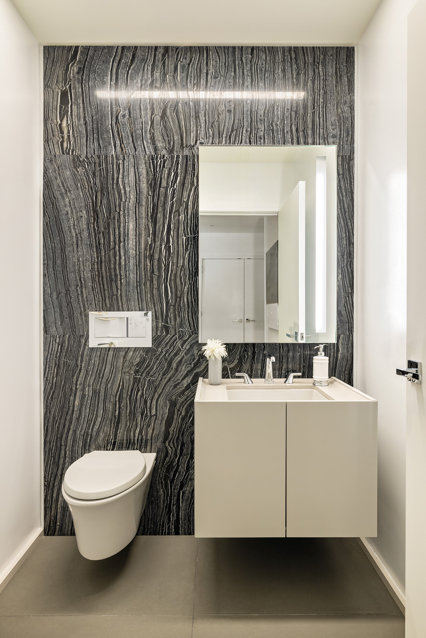 121 East 22nd Street, Unit S603 Manhattan, NY 10010 - Photo 10 of 12 a bathroom with a sink and a mirror