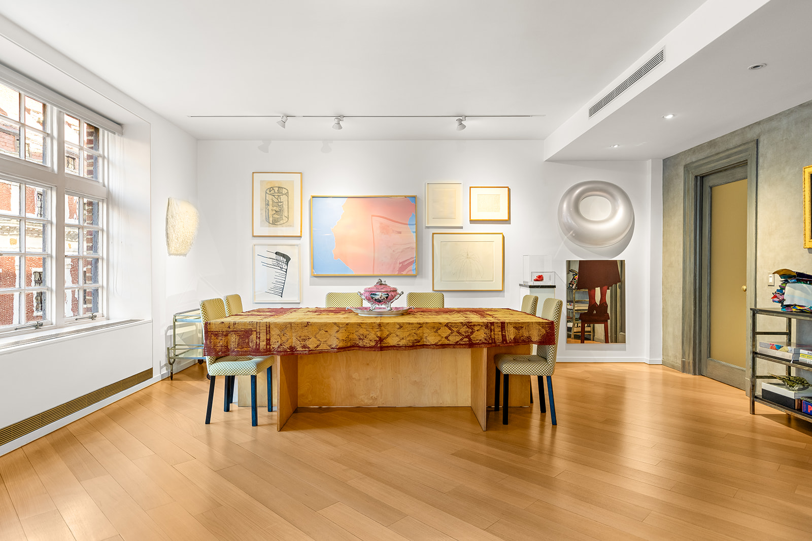 40 East 62nd Street, Unit 6E Manhattan, NY 10065 - Photo 5 of 25 a view of a dining room with furniture and wooden floor