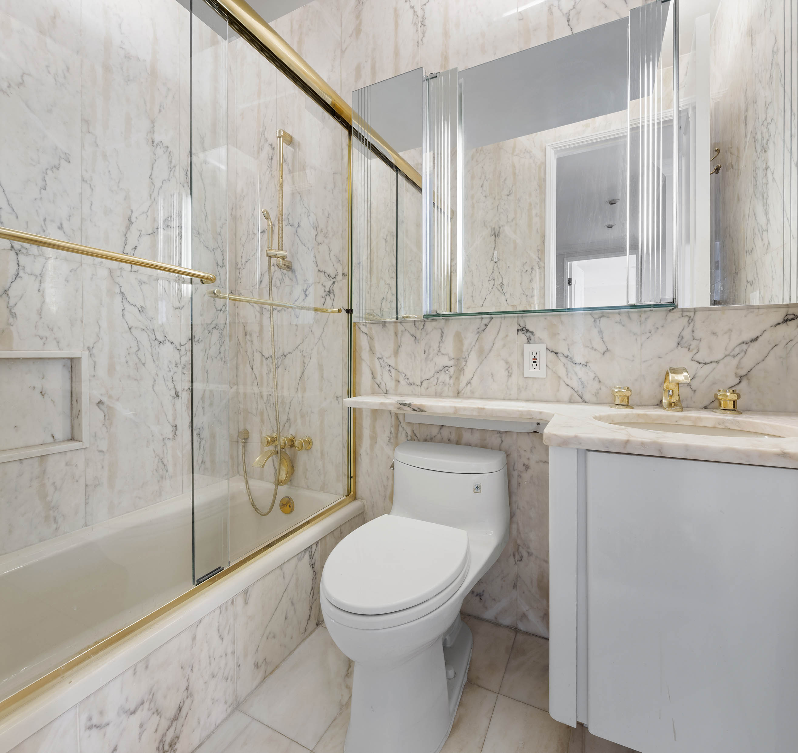 530 East 76th Street, Unit PH36/37E Manhattan, NY 10021 - Photo 18 of 29 a bathroom with a toilet a sink and shower