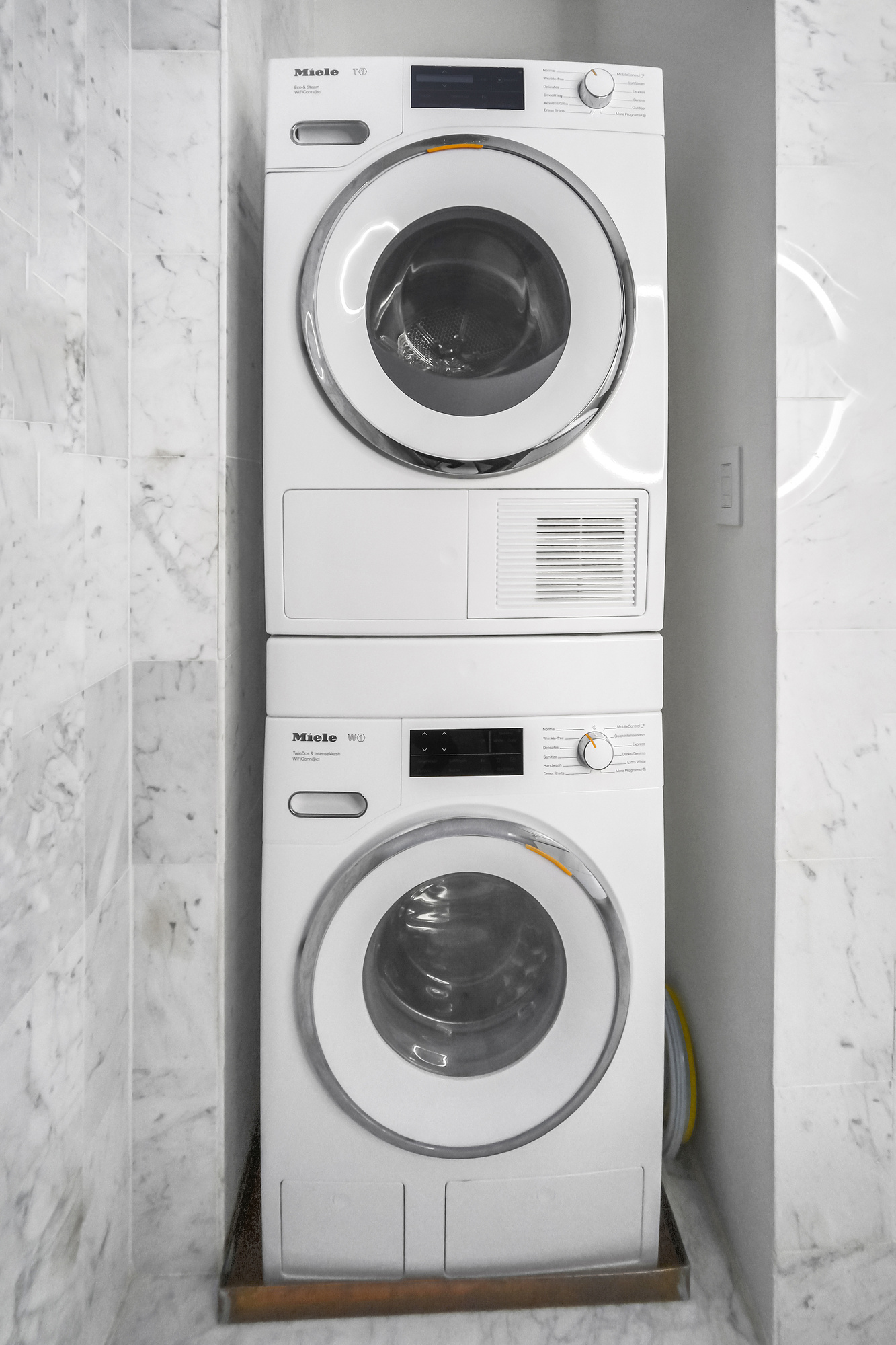 167 East 61st Street, Unit 23D Manhattan, NY 10065 - Photo 6 of 13 a utility room with dryer and washer