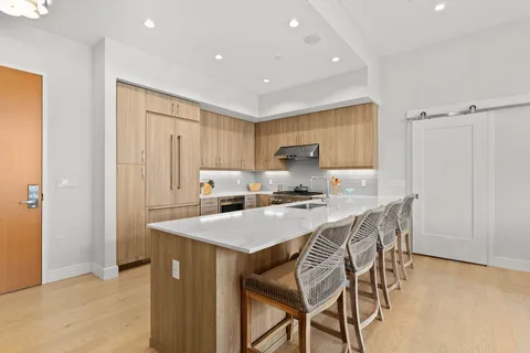 a kitchen with a table and chairs in it