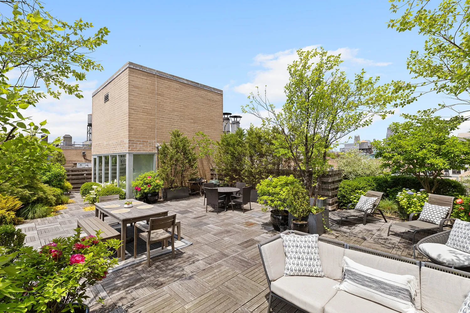 a view of a backyard with plants and patio