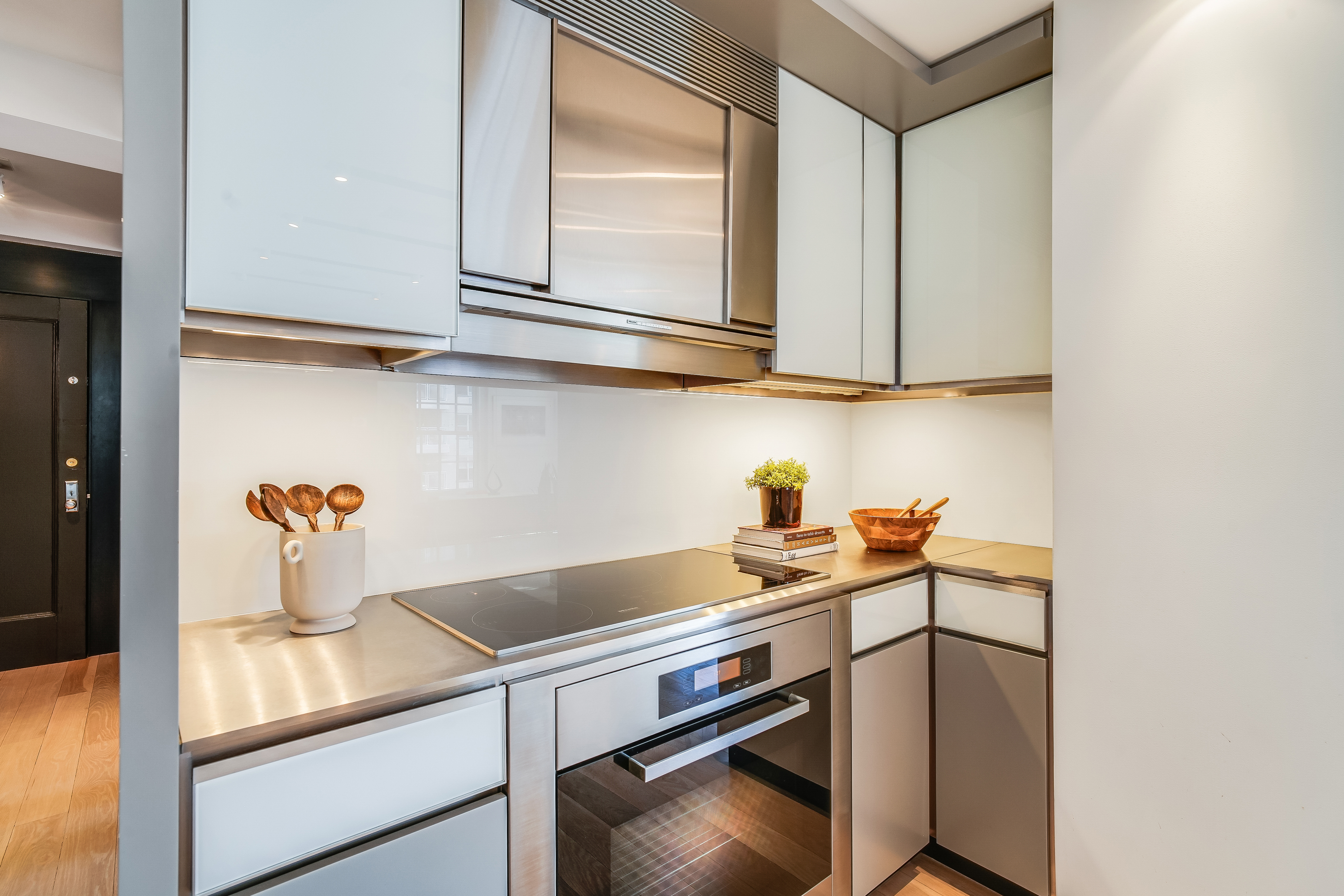 1 5th Avenue, Unit 5GH Manhattan, NY 10003 - Photo 6 of 26 a kitchen with a sink cabinets and appliances