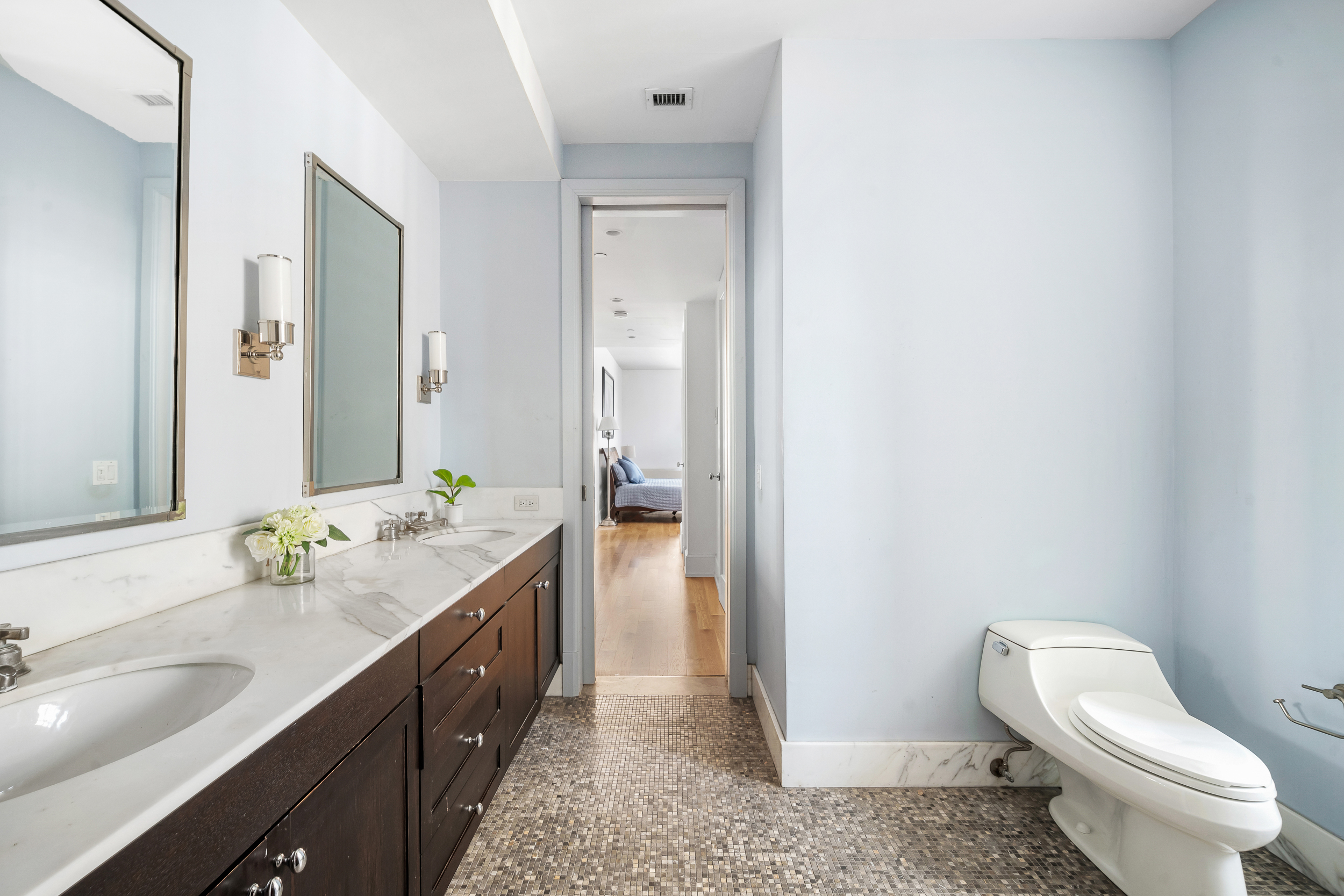 130 West 30th Street, Unit 16A Manhattan, NY 10001 - Photo 9 of 17 a spacious bathroom with a granite countertop sink toilet and shower