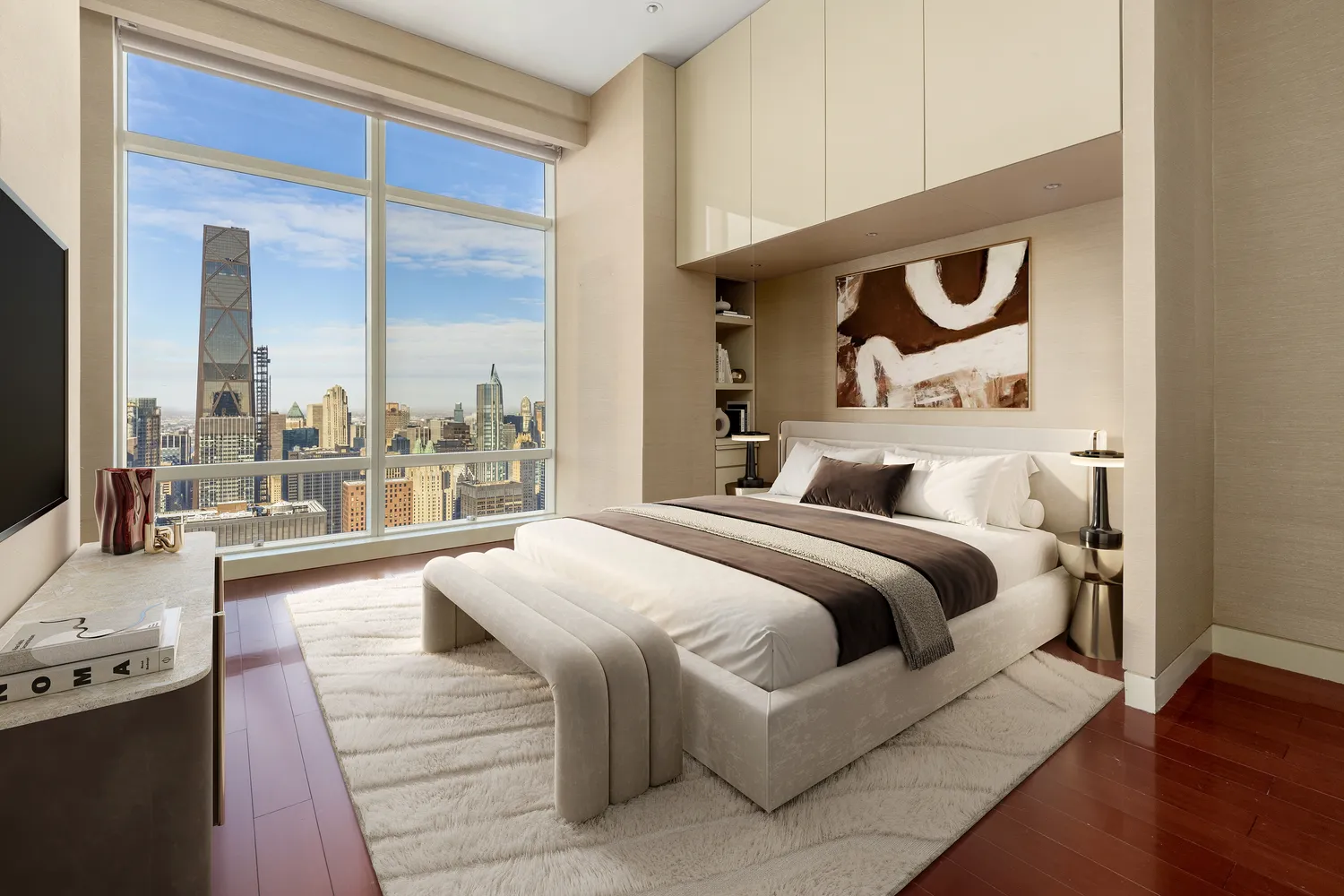 a bedroom with a large bed and a large window