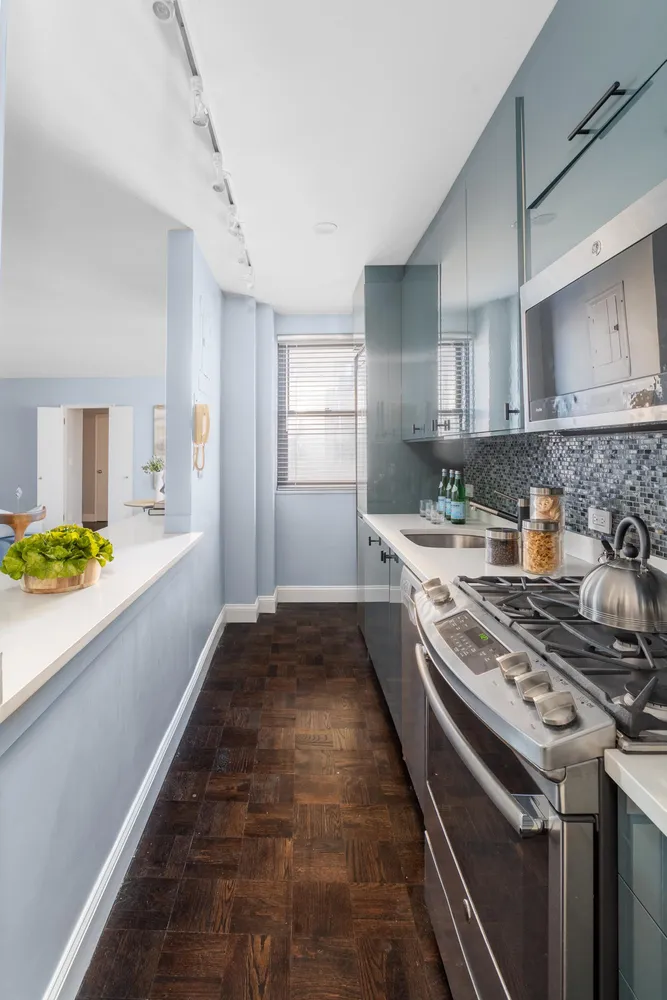 a kitchen with a stove and a sink