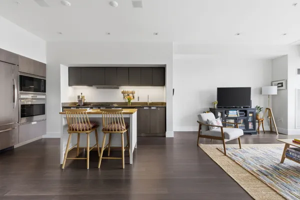 a dining room with furniture and wooden floor