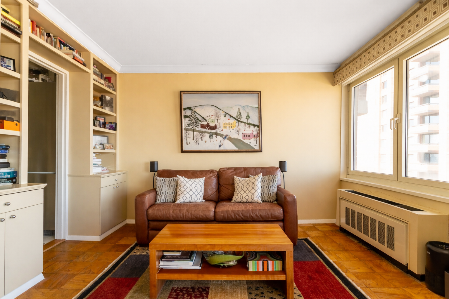 50 East 89th Street, Unit 31C Manhattan, NY 10128 - Photo 7 of 18 a bedroom with a bed and wooden floor