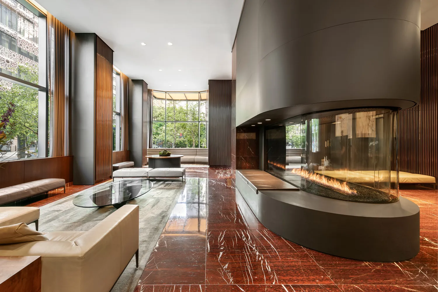 a living room with large window and furniture