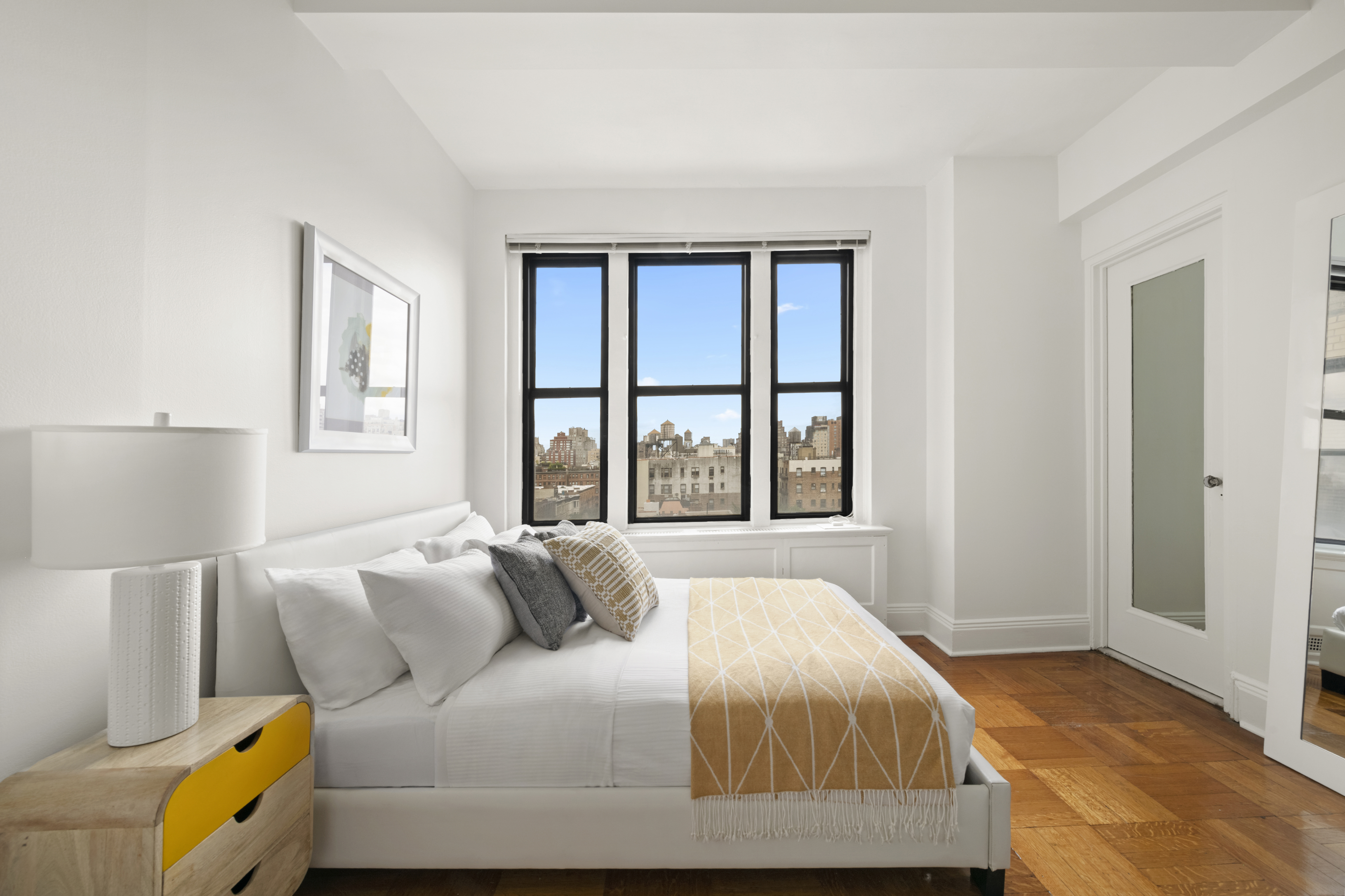 225 Central Park West, Unit 919 Manhattan, NY 10024 - Photo 5 of 15 a bedroom with a bed and window