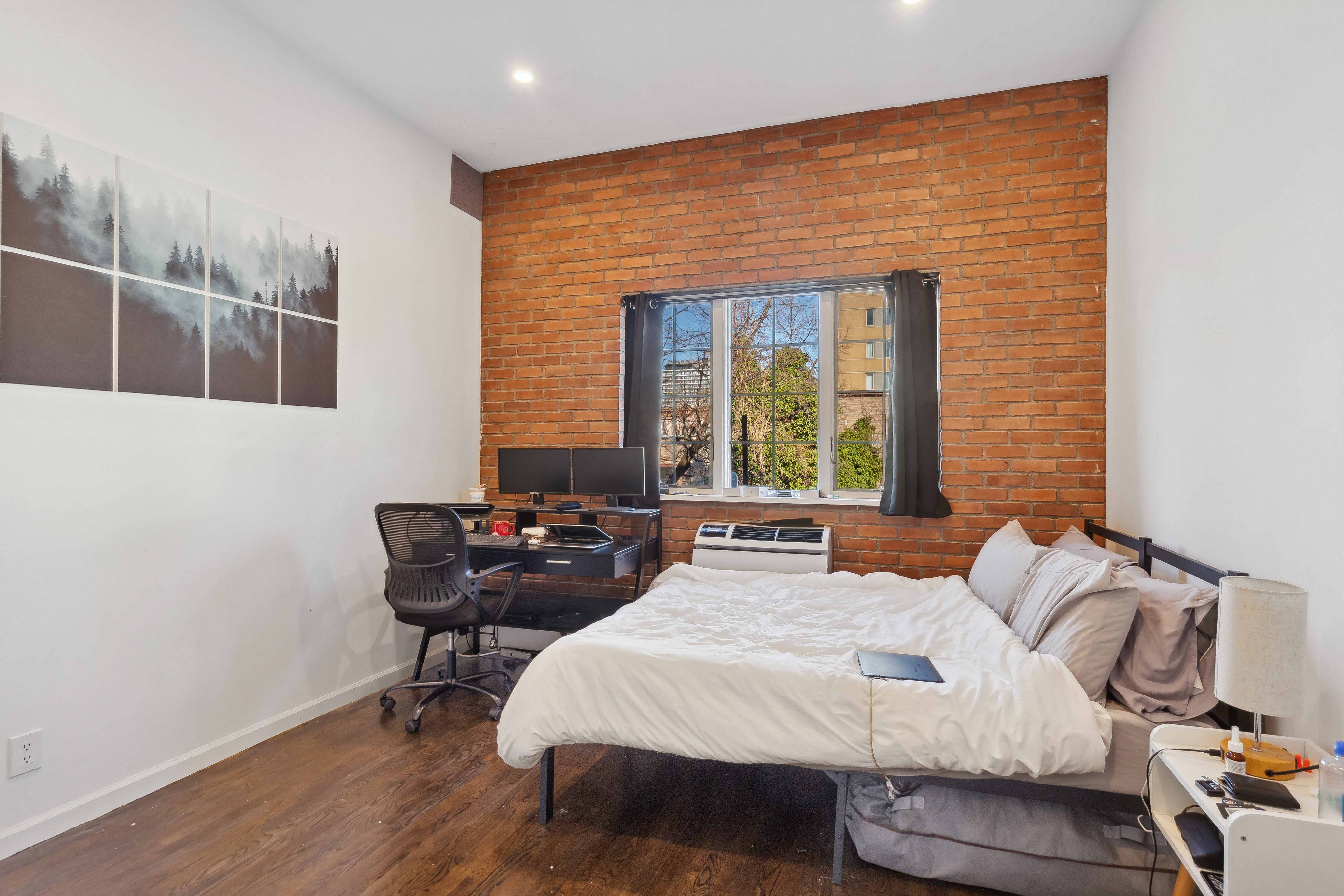 131 North 6th Street, Unit 4 Brooklyn, NY 11249 - Photo 3 of 6 a bedroom with a bed and wooden floor