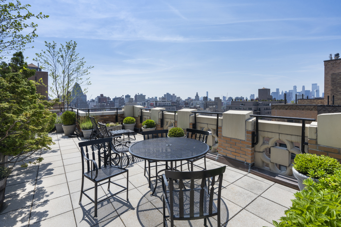 201 West 16th Street, Unit 8F Manhattan, NY 10011 - Photo 9 of 11 a view of a dinning table and chairs in the patio