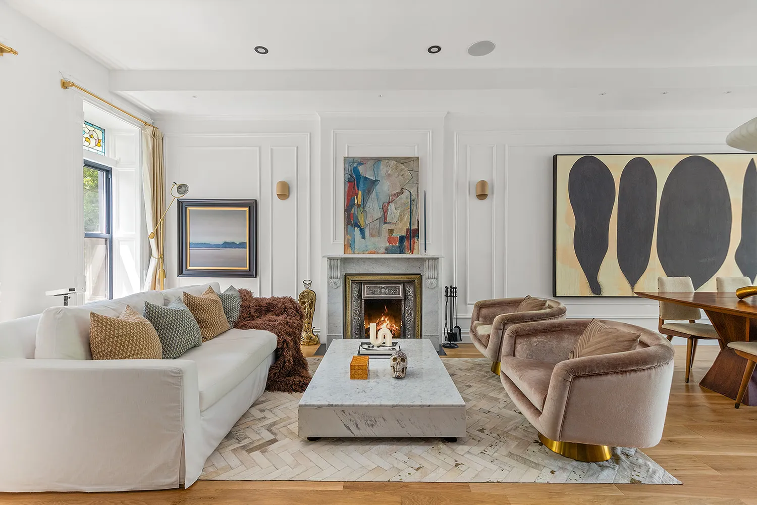 a living room with furniture a fireplace and window
