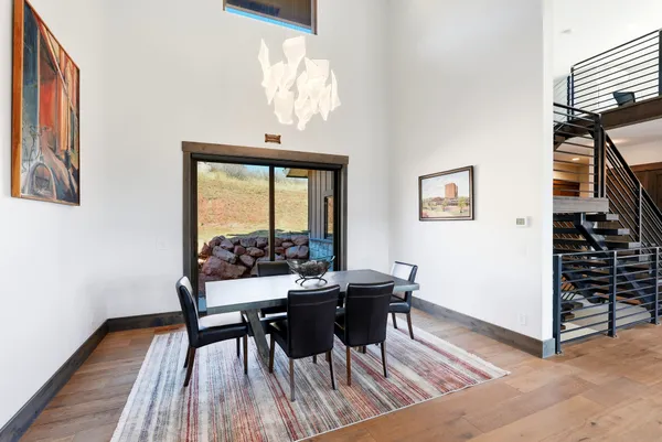 a living room with furniture and large window