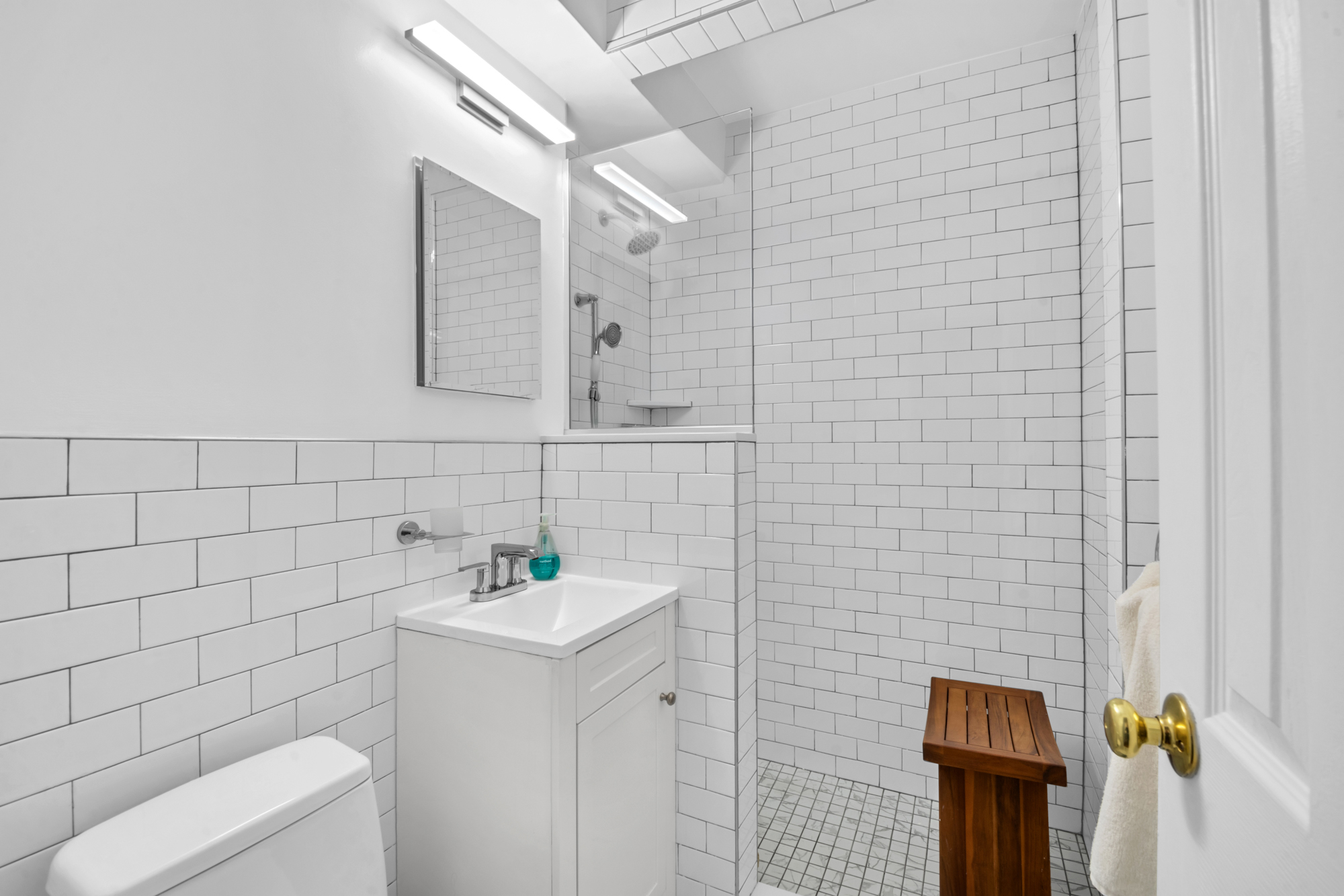 100 Overlook Terrace, Unit 85 Manhattan, NY 10040 - Photo 6 of 8 a bathroom with a sink a toilet and shower