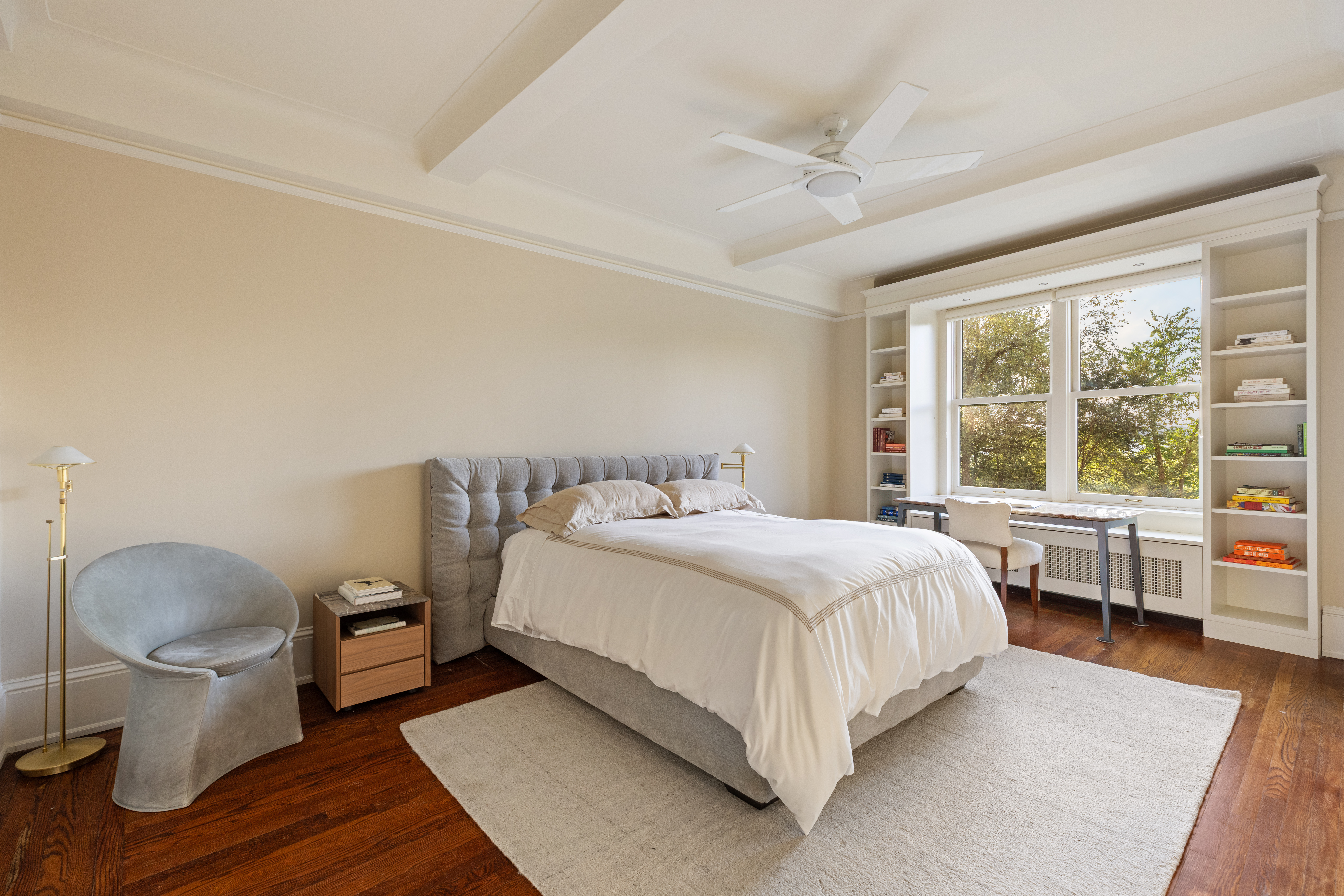 186 Riverside Drive, Unit 5F Manhattan, NY 10024 - Photo 7 of 15 a bedroom with a bed and a large window with outer view