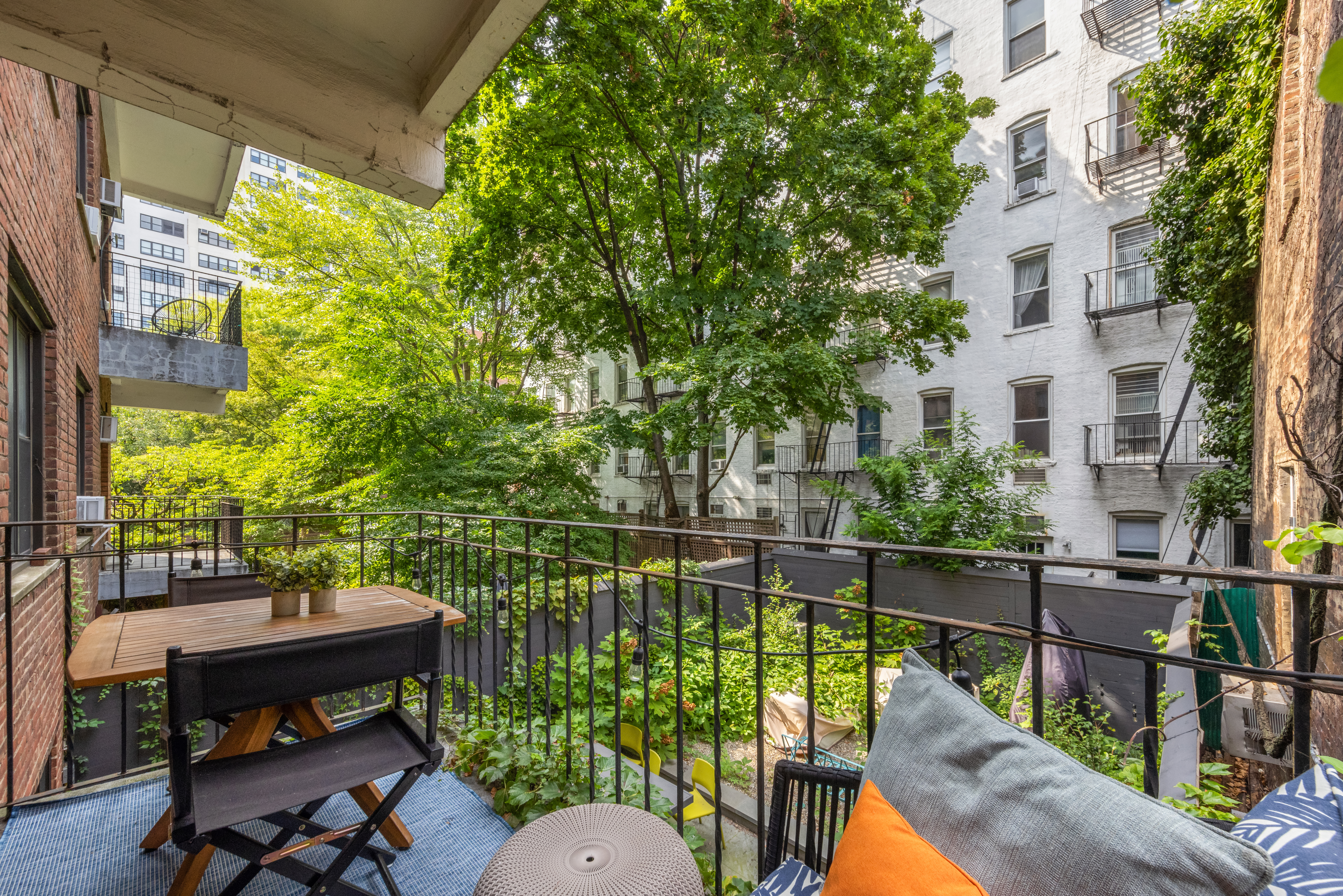 11 Charlton Street, Unit 2C Manhattan, NY 10014 - Photo 3 of 7 a view of a balcony with two chairs and a table
