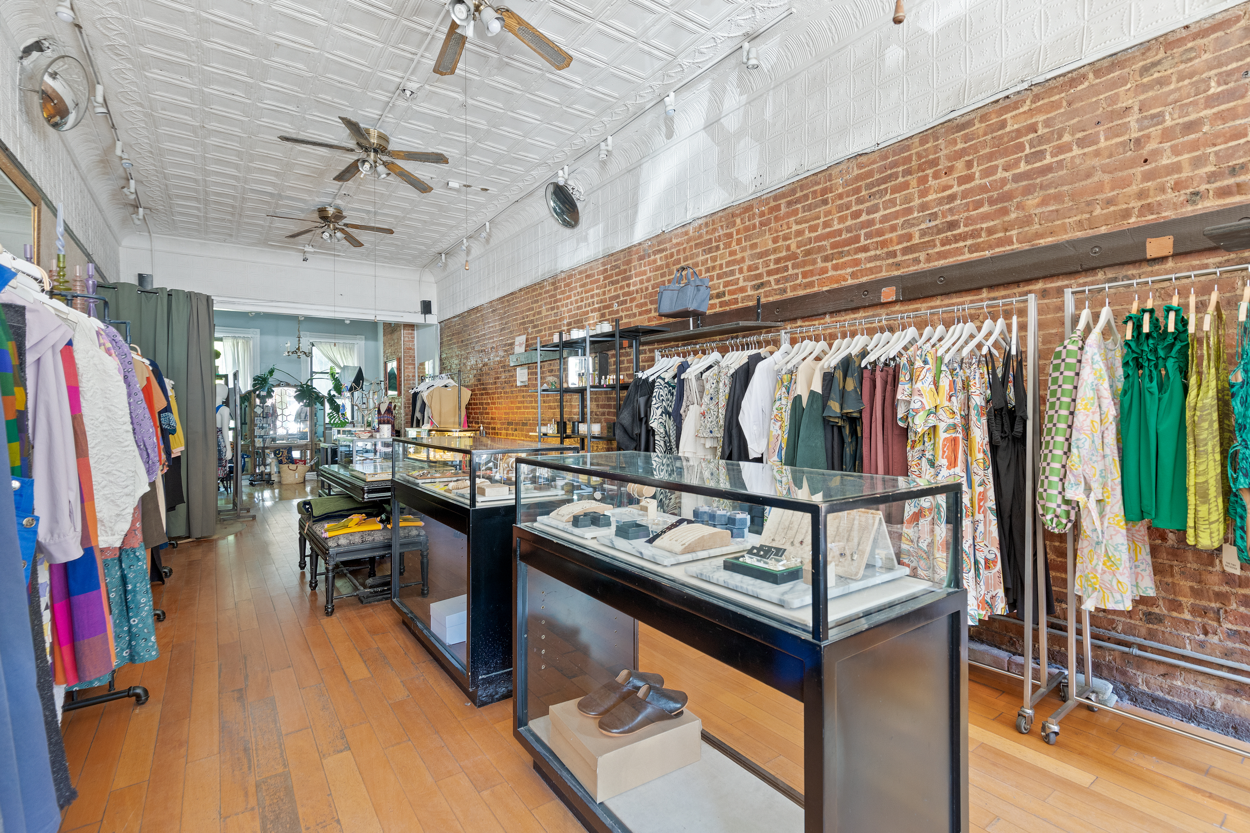 360 7th Avenue, Unit STORE Brooklyn, NY 11215 - Photo 2 of 8 a view of walk in closet with clothes and shoes
