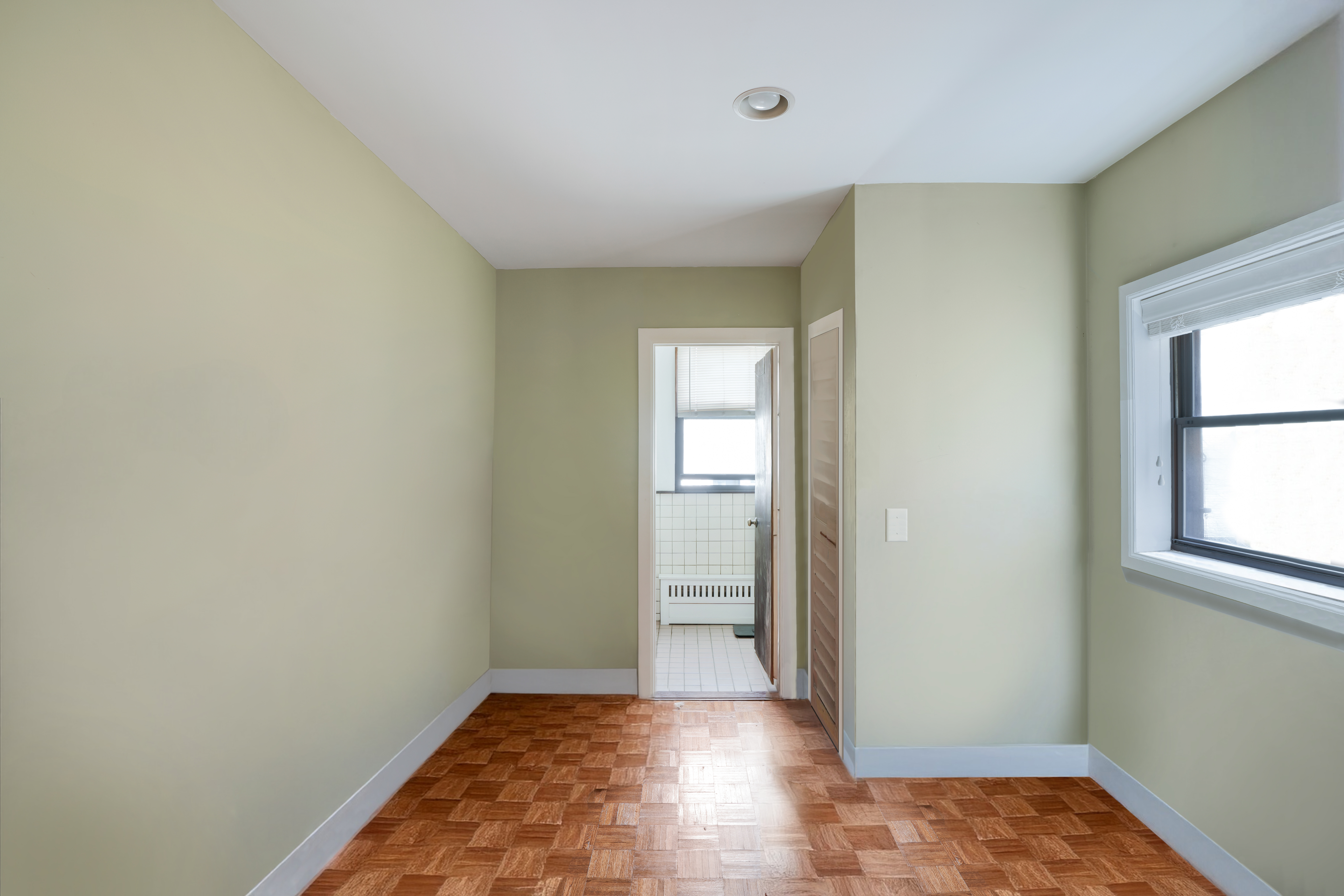 337 West 71st Street, Unit 3 Manhattan, NY 10023 - Photo 8 of 9 an empty room with closet and windows
