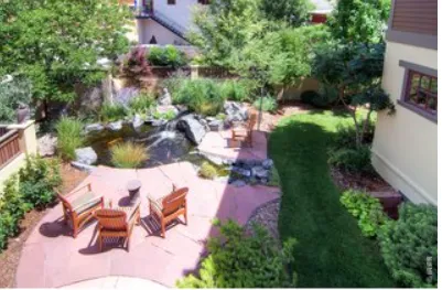 an aerial view of a house with a yard and lake view