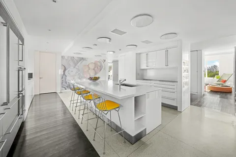 a kitchen with stainless steel appliances granite countertop a sink and cabinets