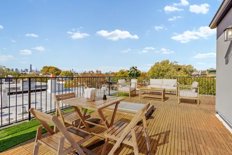 a view of a terrace with seating area