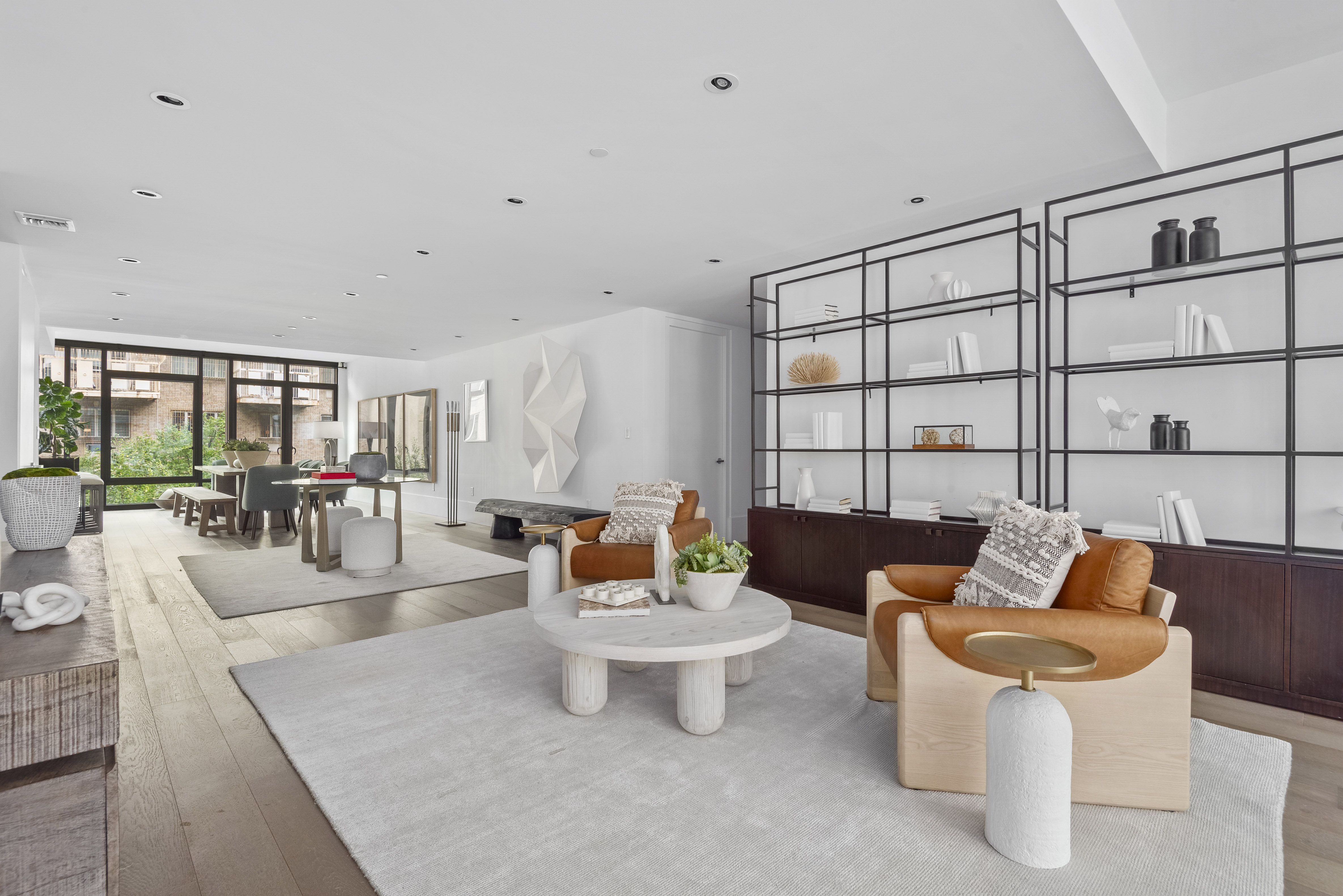 429 Kent Avenue, Unit L32 Brooklyn, NY 11249 - Photo 2 of 15 a living room with furniture and a table