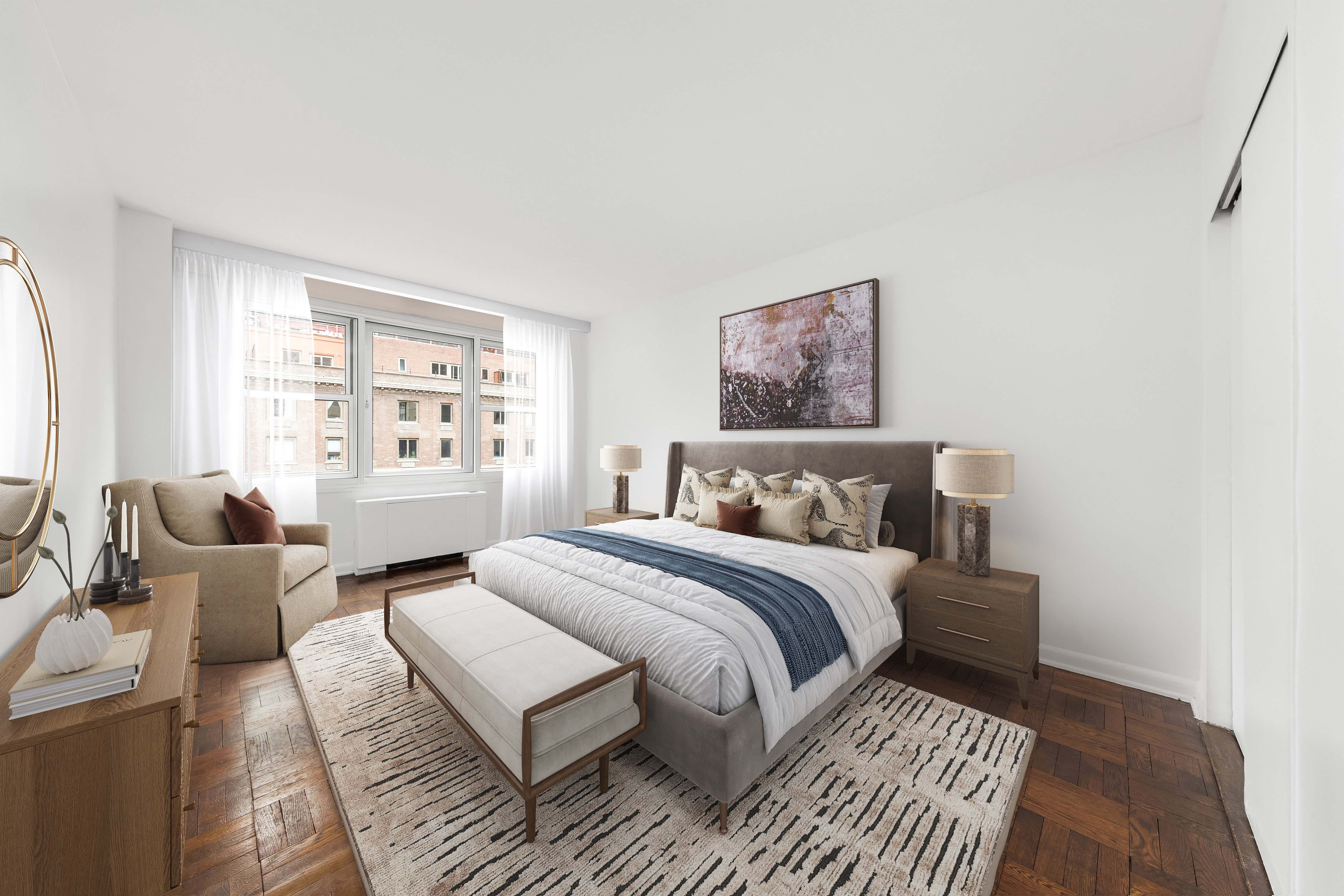 77 West 55th Street, Unit 17F Manhattan, NY 10019 - Photo 5 of 12 a bedroom with a large bed and a couch
