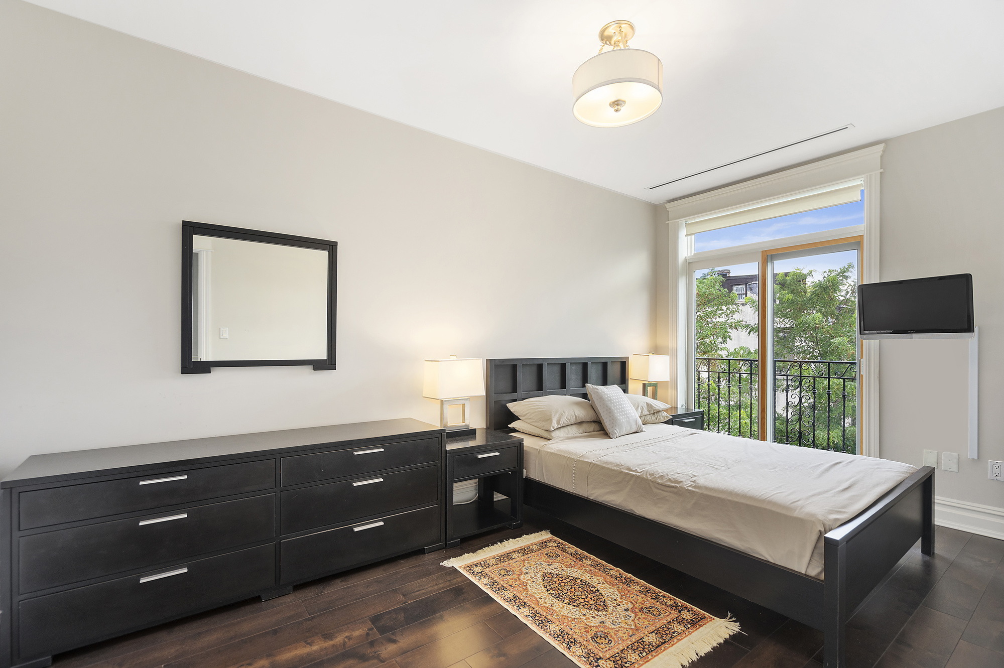 67 Greene Avenue, Unit 2 Brooklyn, NY 11238 - Photo 9 of 15 a bedroom with a bed and a window