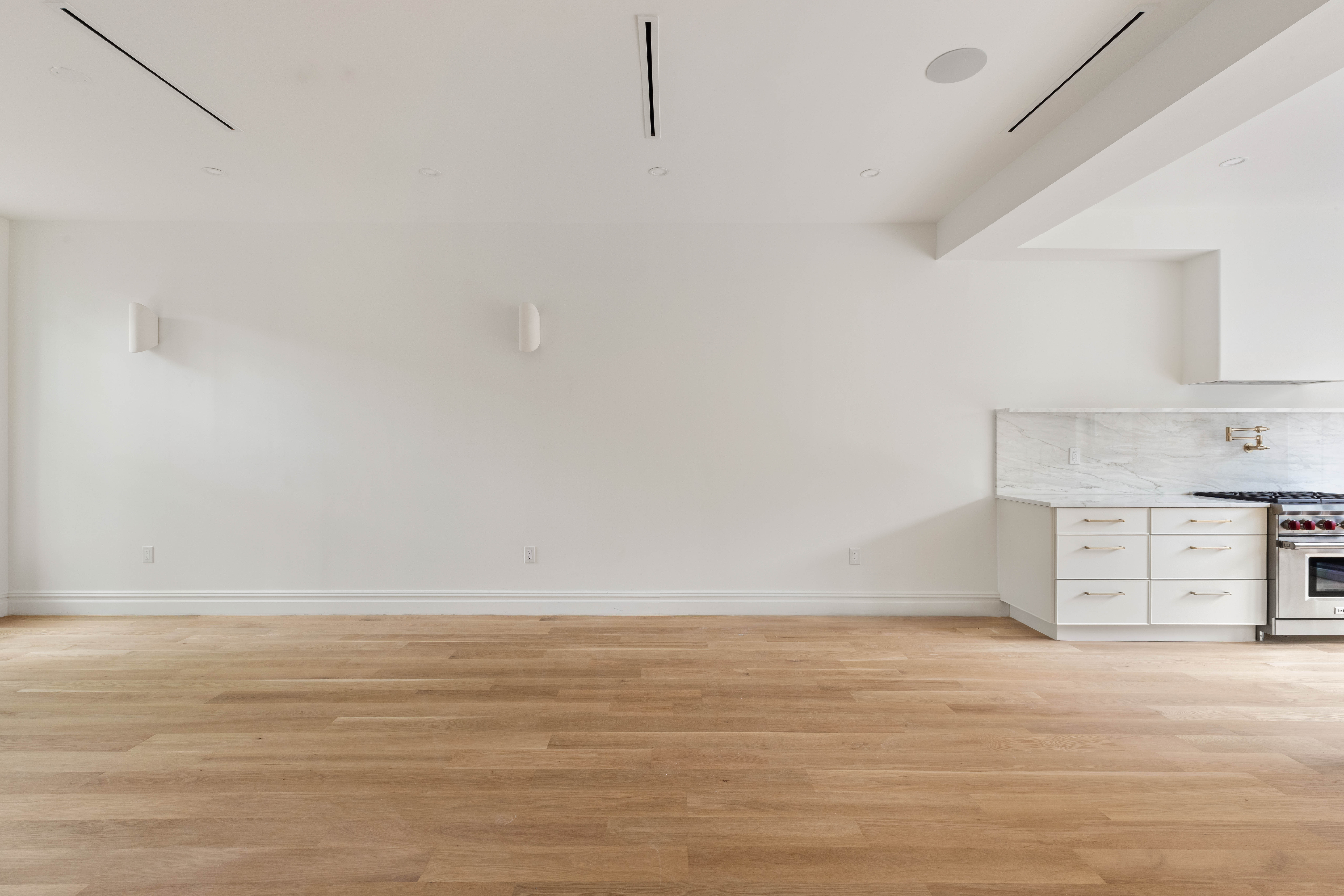 318 Halsey Street Brooklyn, NY 11216 - Photo 3 of 16 a view of a kitchen with a sink and a refrigerator