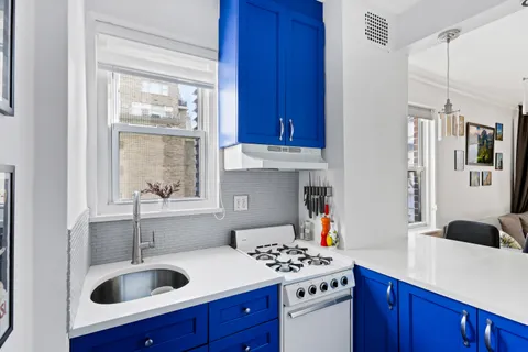 a kitchen with a sink and cabinets