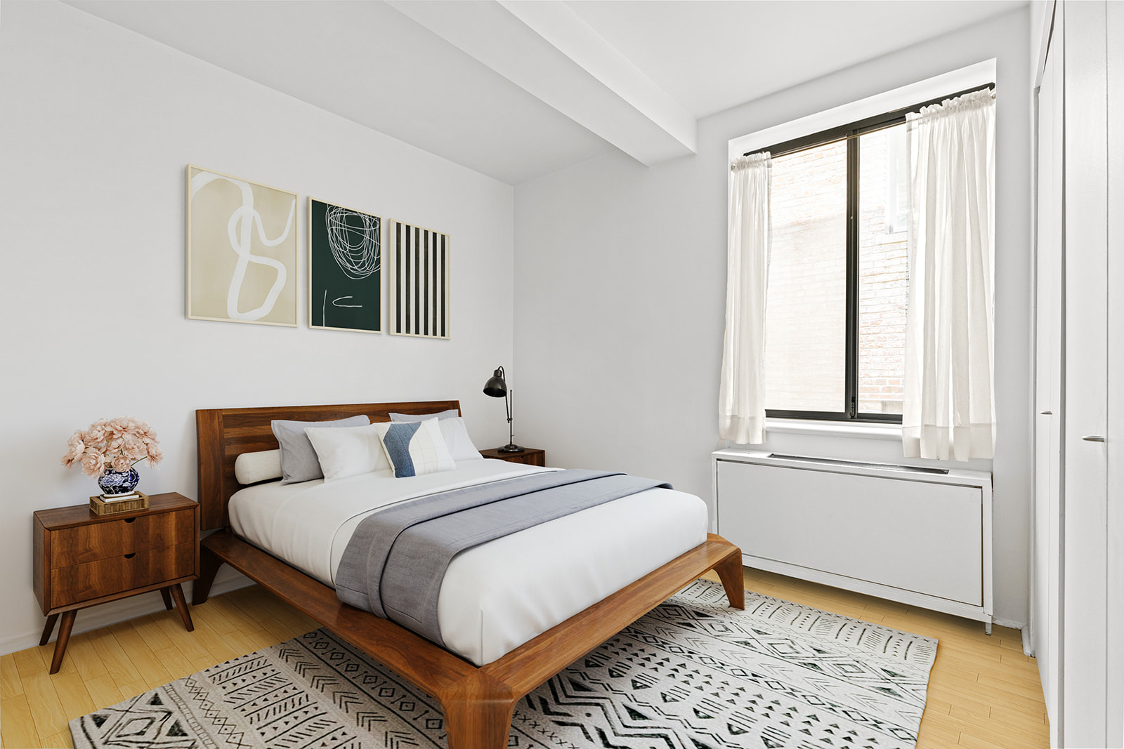 167 Perry Street, Unit 5F Manhattan, NY 10014 - Photo 4 of 12 a bedroom with a bed lamp and a window