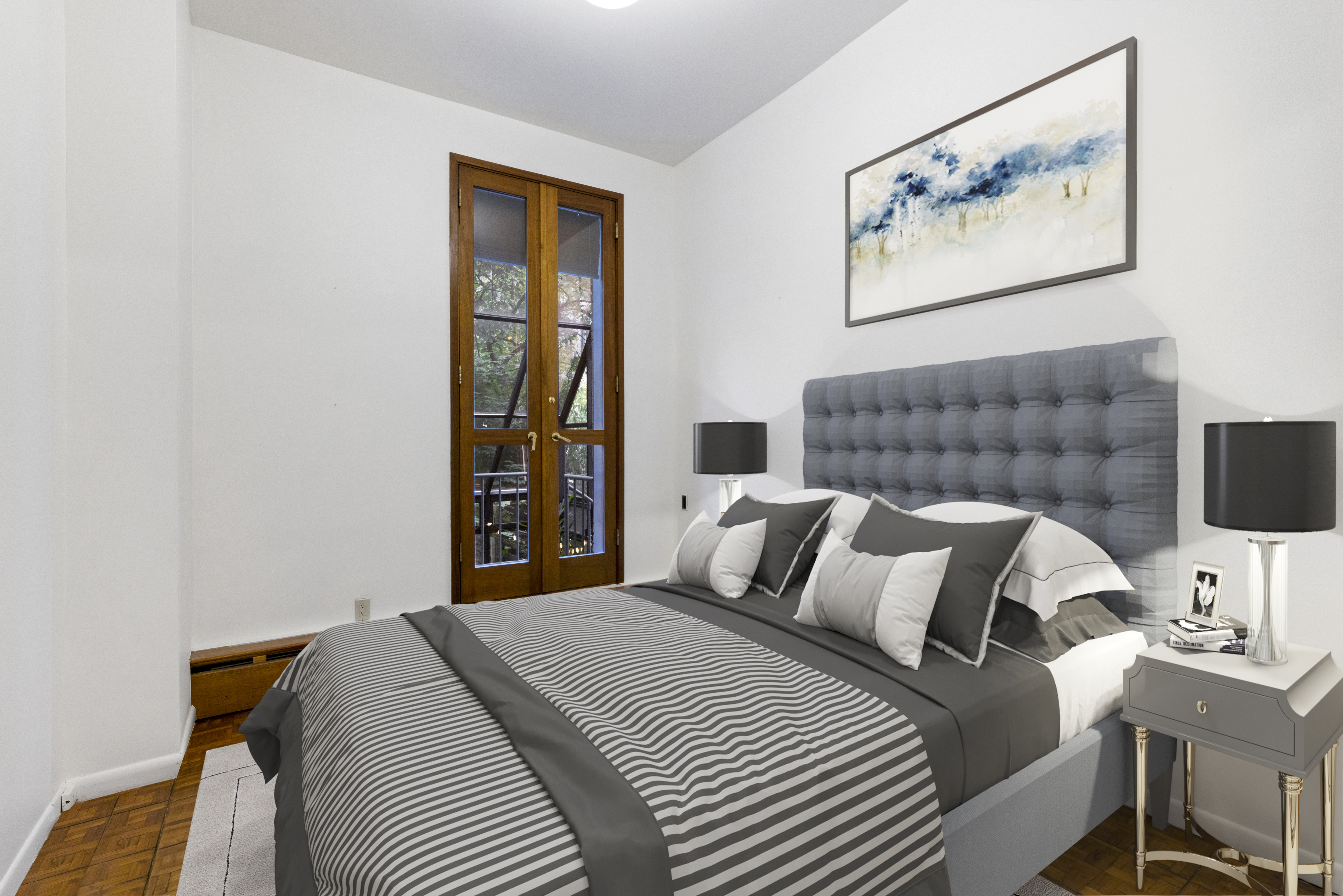 136 East 30th Street, Unit DUPLEX Manhattan, NY 10016 - Photo 8 of 26 a bedroom with a bed and a couch