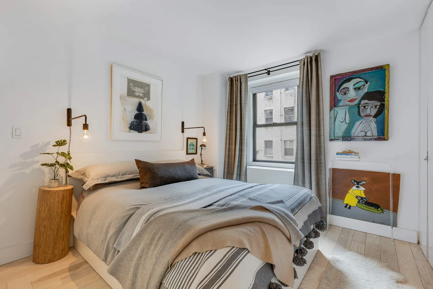 a bedroom with a bed and cupboard